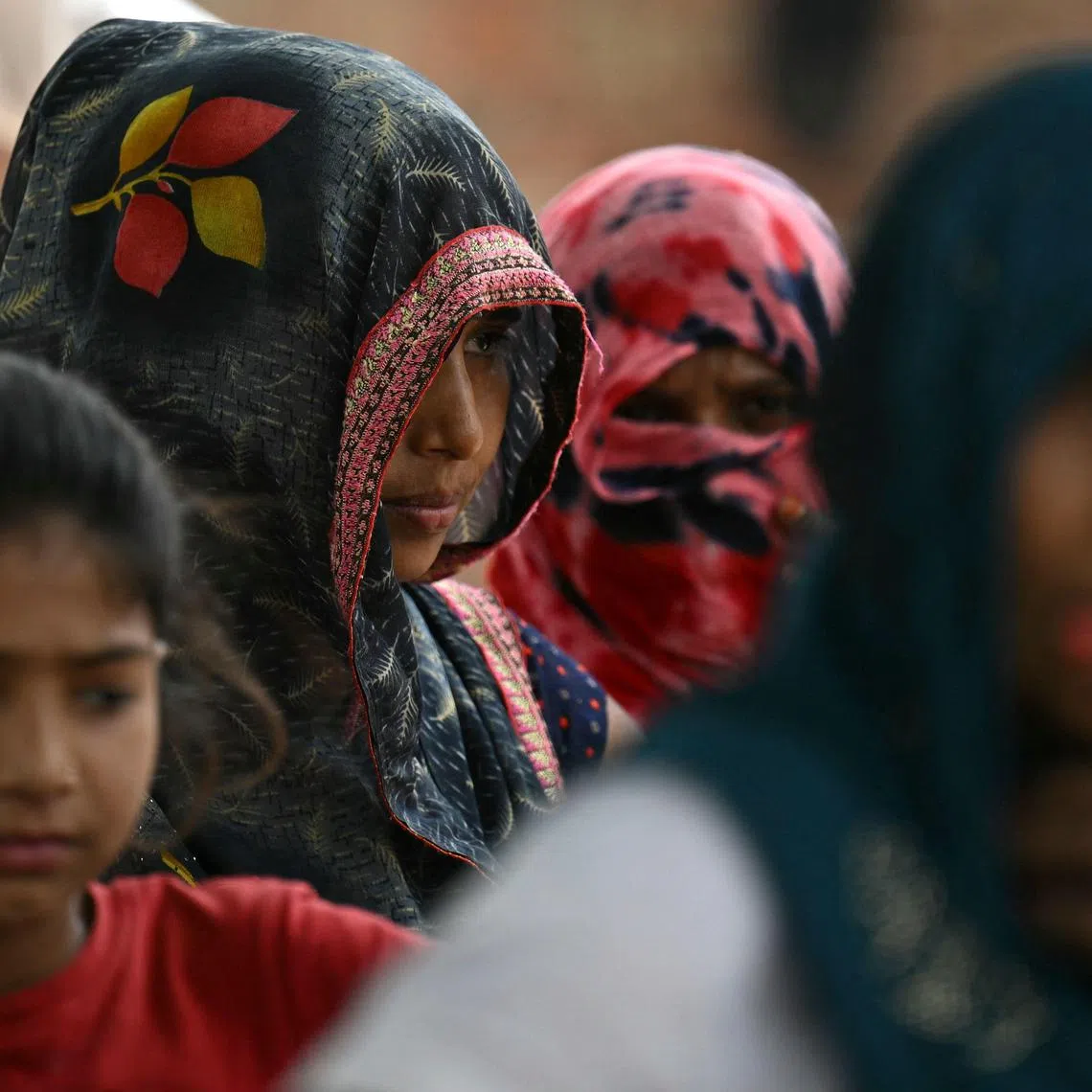 CORRECTION / In this photograph taken on May 6, 2024, women from India's marginalised Dalit caste are pictured in Ayela village on the outskirts of Agra. More than two-thirds of India's 1.4 billion people are estimated to be on the lower rungs of a millennia-old social hierarchy that divides Hindus by function and social standing. Modi's Hindu-nationalist Bharatiya Janata Party (BJP) has established itself as India's dominant political force with a different pitch: think of your religion first, and caste second. (Photo by Money SHARMA / AFP) / TO GO WITH: India-Vote-Caste, FOCUS Arunabh SAIKIA / “The erroneous mention[s] appearing in the metadata of this photo by Money SHARMA has been modified in AFP systems in the following manner: [clarifying caption to add reference of Dalit as the marginalised caste]. Please immediately remove the erroneous mention[s] from all your online services and delete it (them) from your servers. If you have been authorized by AFP to distribute it (them) to third parties, please ensure that the same actions are carried out by them. Failure to promptly comply with these instructions will entail liability on your part for any continued or post notification usage. Therefore we thank you very much for all your attention and prompt action. We are sorry for the inconvenience this notification may cause and remain at your disposal for any further information you may require.”