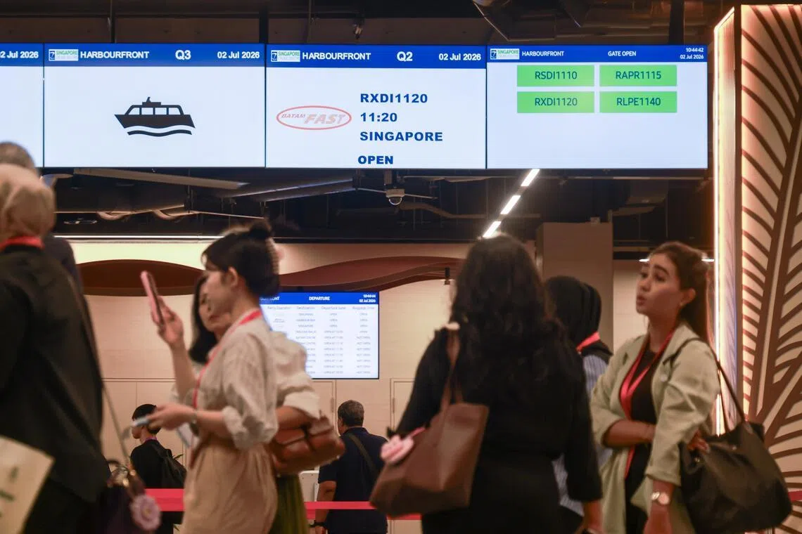 People queuing for pre-immigration security checks at the new Singapore Cruise Centre (HarbourFront) terminal as part of an operational readiness test on July 2.