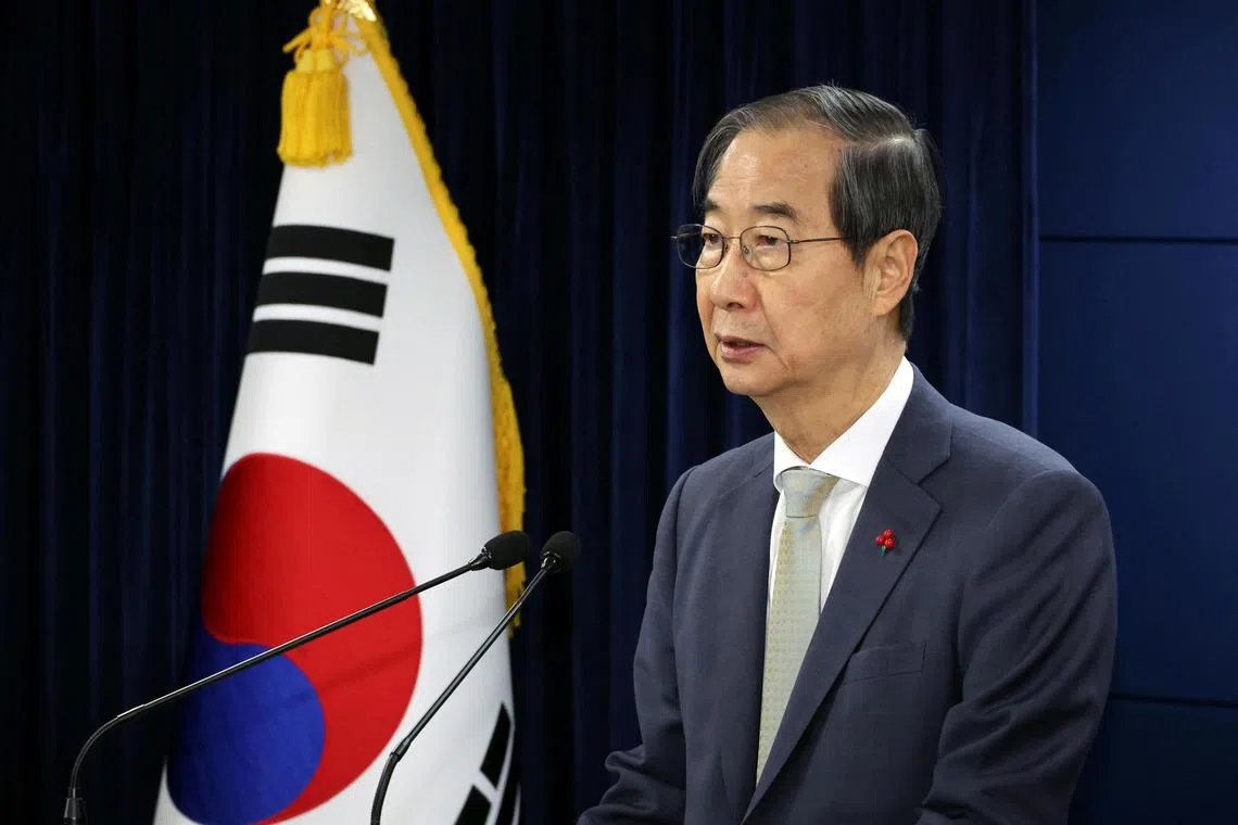 Han Duck-soo, South Korea's acting president, speaking during a news conference on Dec 14 after lawmakers passed a motion to impeach South Korean President Yoon Suk Yeol in Seoul.