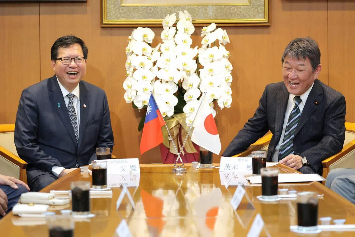 Cheng Wen-tsan (L), Vice Premier of Taiwan, and Japan's ruling Liberal Democratic Party Secretary General Toshimitsu Motegi hold a meeting at the party's headquarters in Tokyo on June 28, 2023. (Photo by JIJI Press / AFP) / Japan OUT