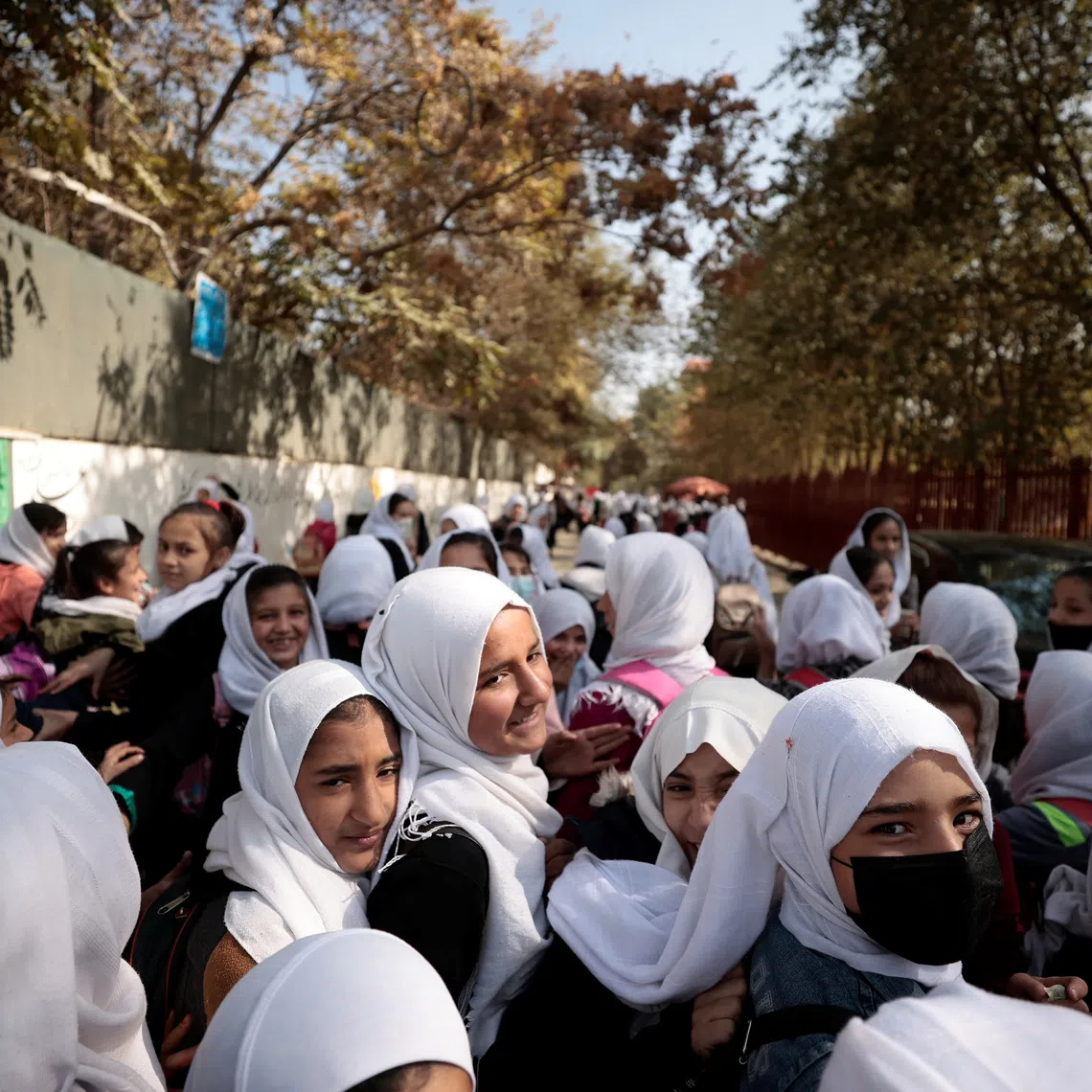 FILE PHOTO: Female primary school students leave school after a class in Kabul, Afghanistan, October 25, 2021. REUTERS/Zohra Bensemra/File Photo