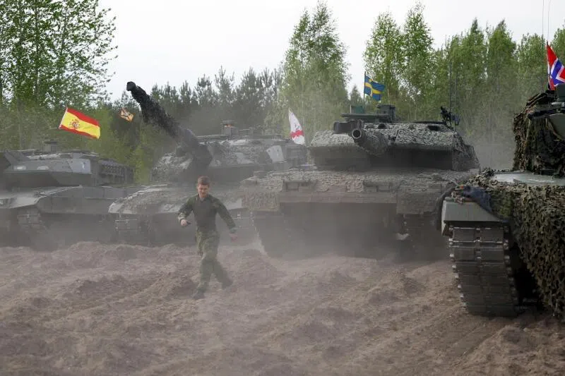 Soldiers with their battle tanks participating in the NATO Iron Spear exercise in Adazi training ground, Latvia, on May 18, 2026. 
