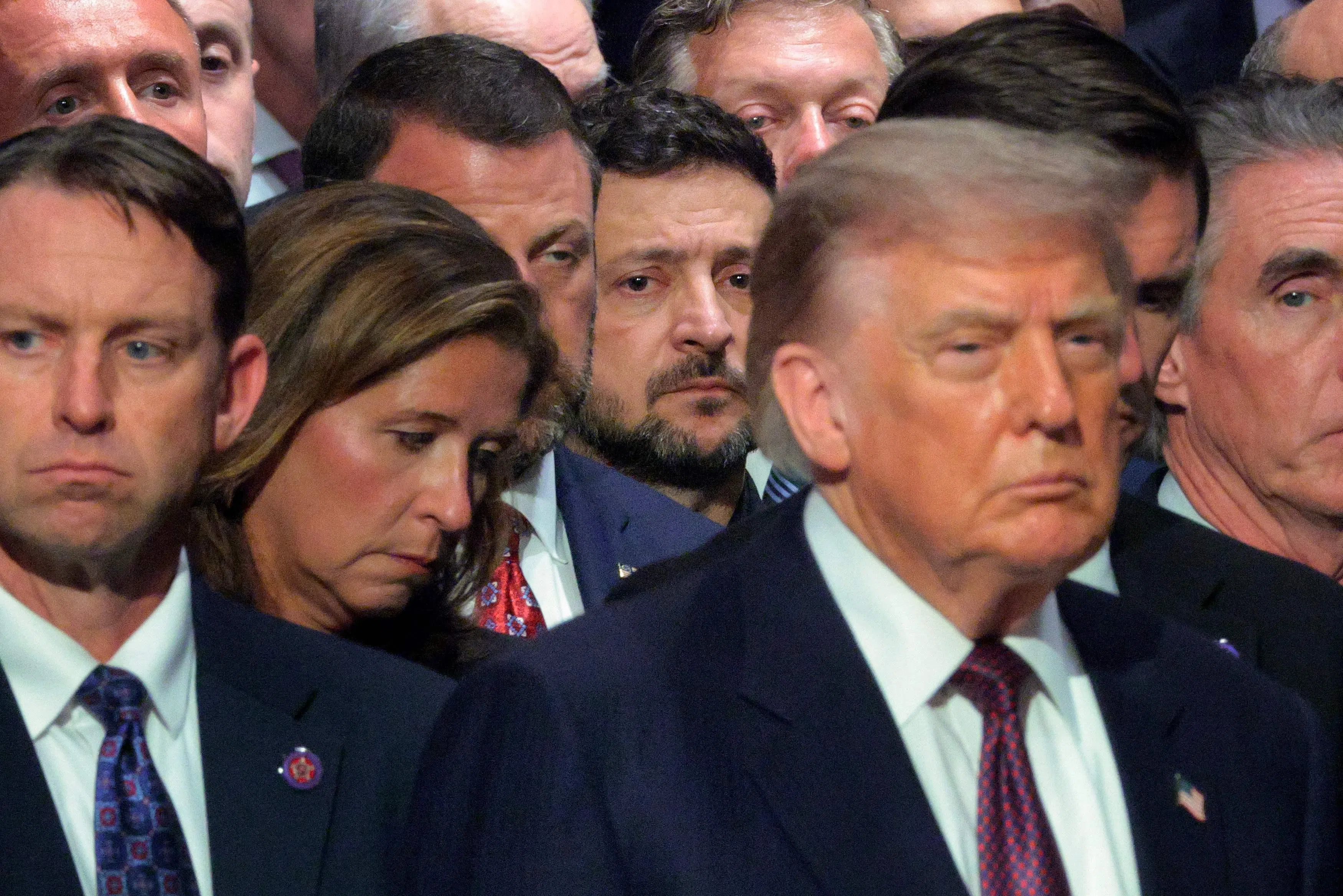 Ukrainian President Volodymyr Zelensky (centre) attending the funeral for the late US Senator Lindsey Graham with US President Donald Trump and other leaders, on July 28.