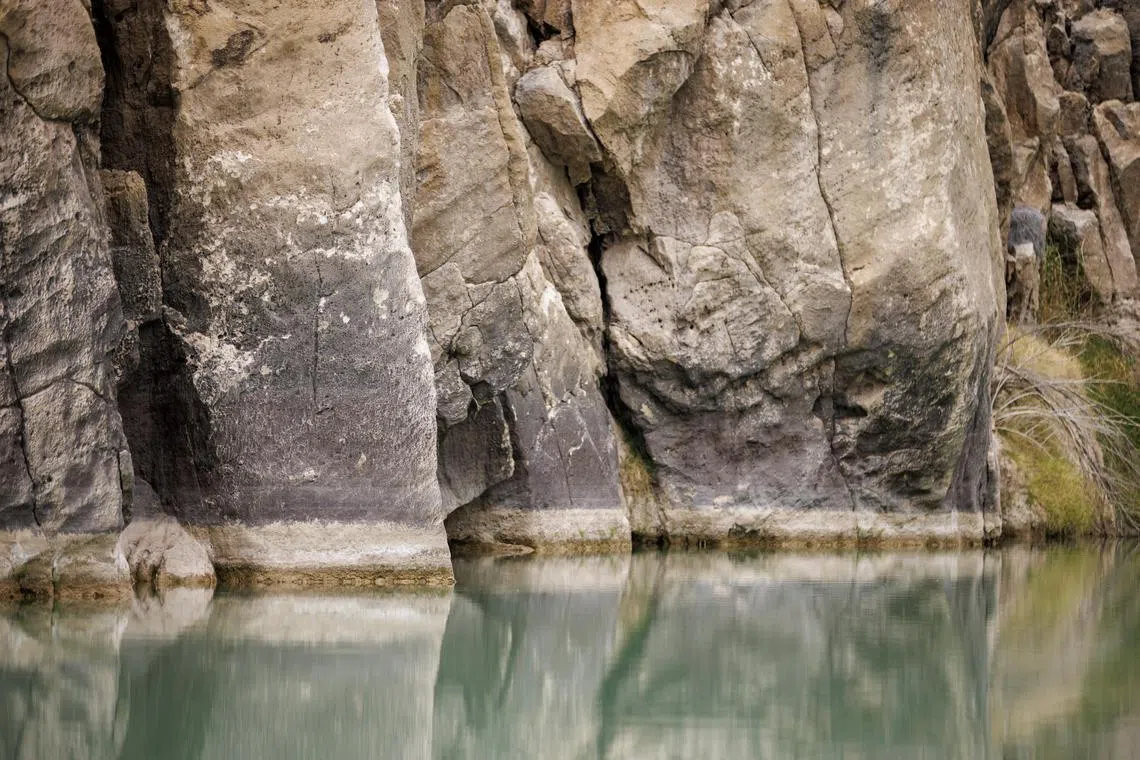 Previous water levels etched in rocks on the Rio GrandeÕs Temple Canyon route, near Big Bend National Park in Texas, on March 17, 2024. Canoeing the Rio Grande can be magical. But as the river dries, itÕs getting harder to find a stretch where a boat will actually float. (Ivan Pierre Aguirre/The New York Times)