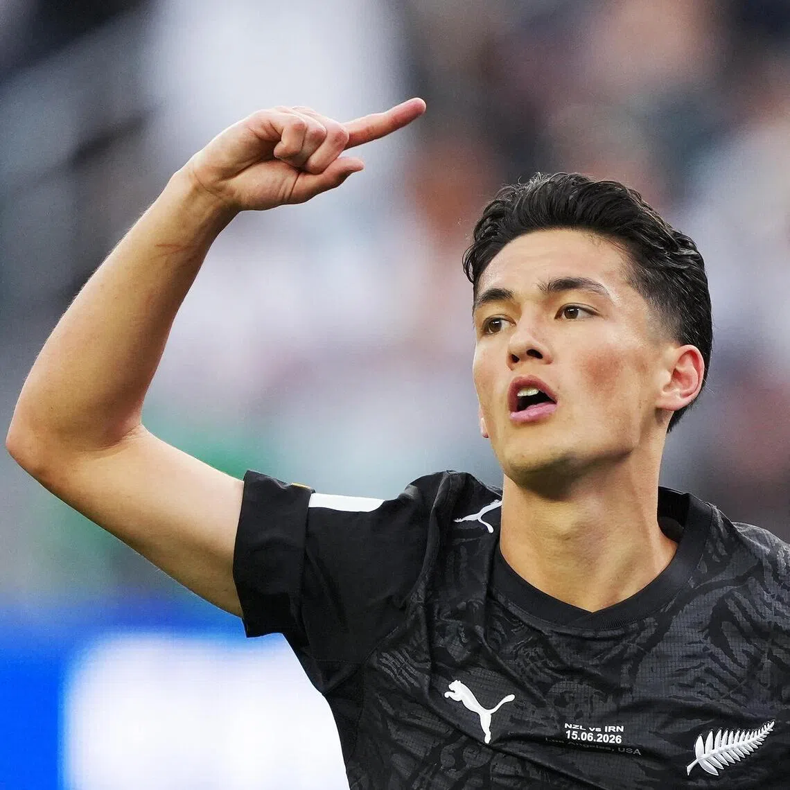 New Zealand's Elijah Just celebrates scoring their first goal against Iran.