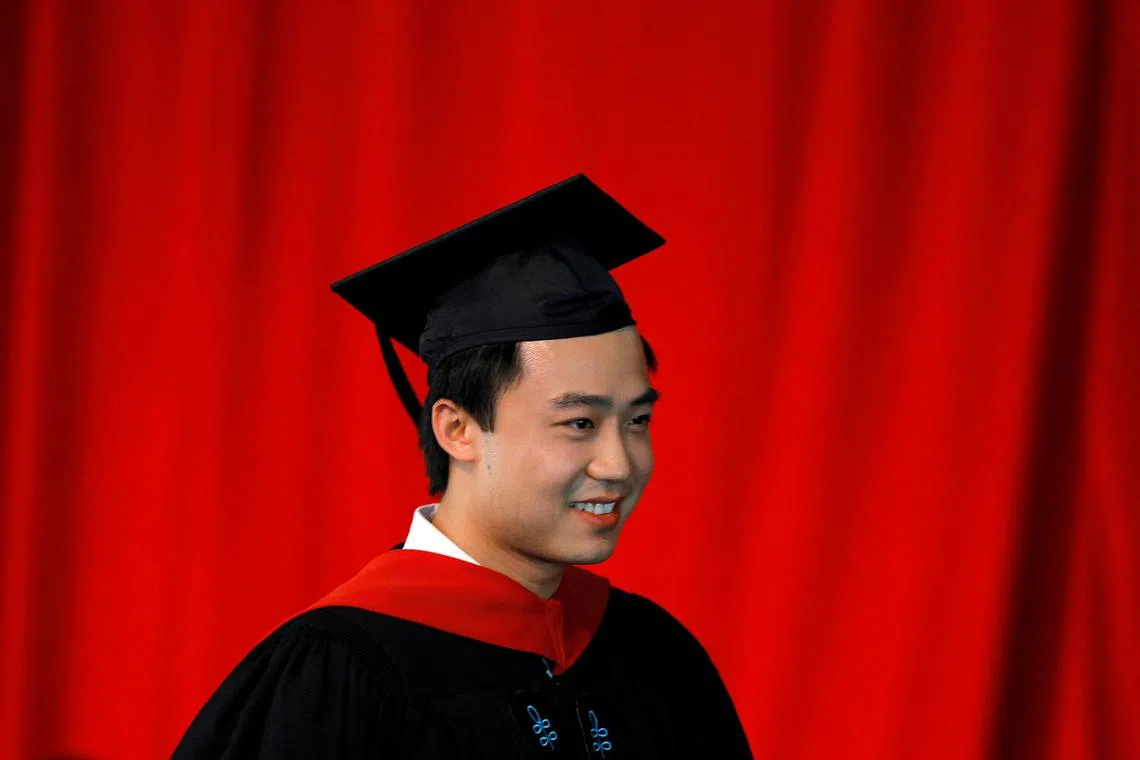 FILE PHOTO: Bo Guagua, son of fallen Chinese politician Bo Xilai, walks offstage after receiving his masters degree in public policy at the John F. Kennedy School of Government during the 361st Commencement Exercises at Harvard University in Cambridge, Massachusetts May 24, 2012. REUTERS/Brian Snyder/File Photo
