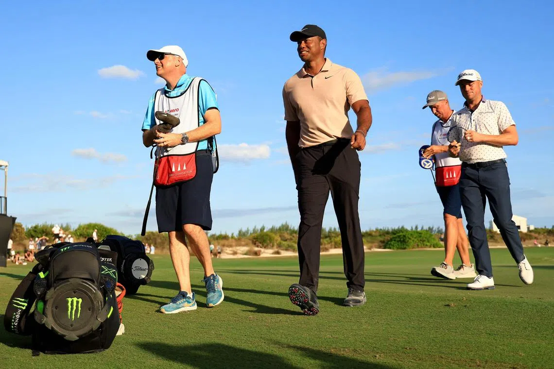 Tiger Woods walks off the 18th hole during the first round of the Hero World Challenge at Albany Golf Course.