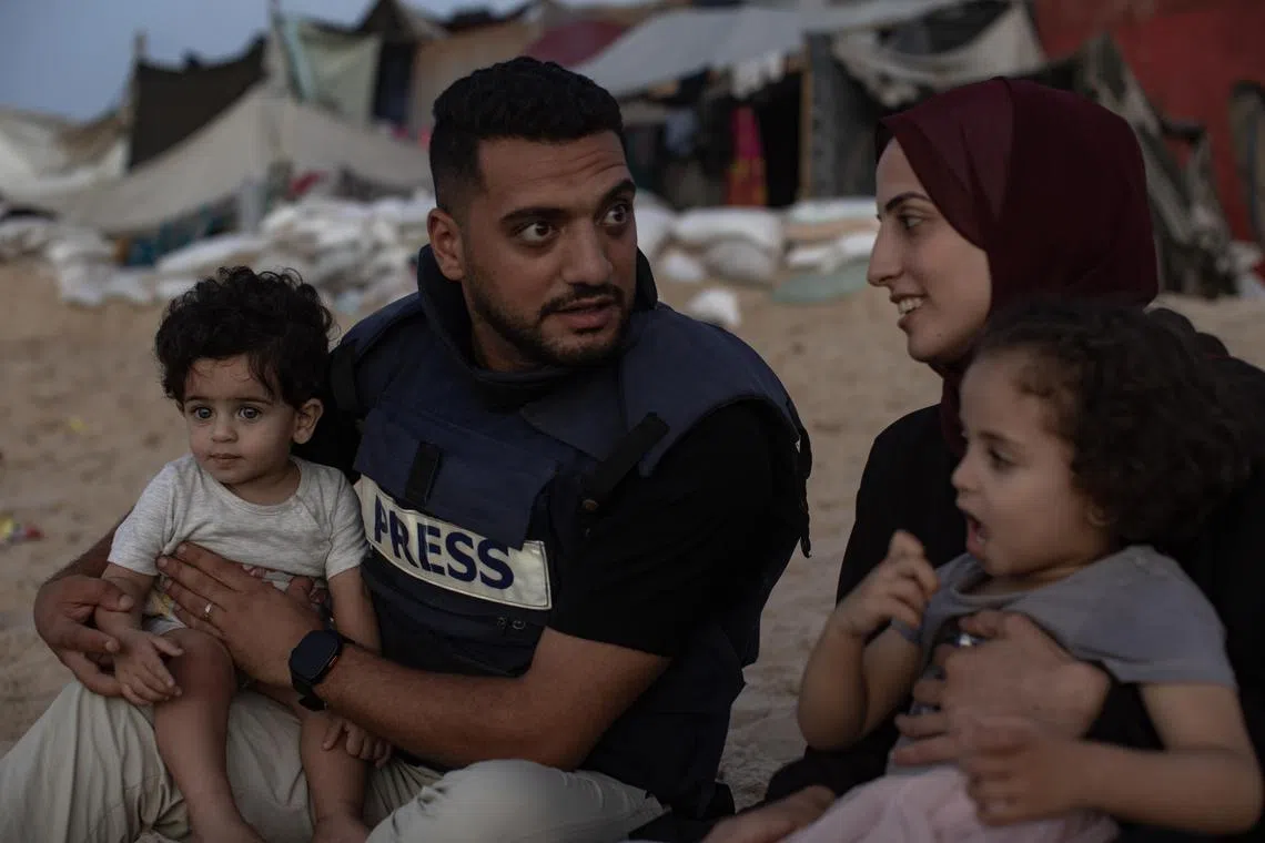 Palestinian journalist Ghazi Ashraf El-Alloul enjoys a day at the beach with his family in Gaza.