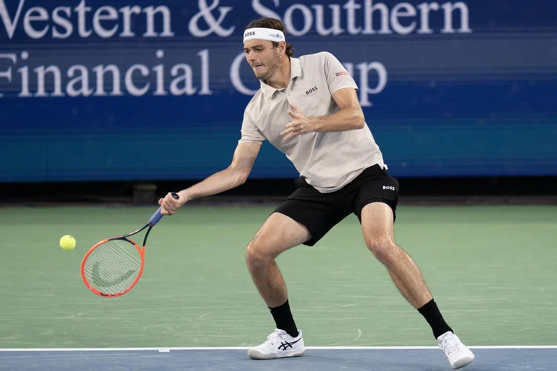 FILE PHOTO: Aug 13, 2024; Cincinnati, OH, USA ; Taylor Fritz of the United States returns a shot during his match against Brandon Nakashima of the United States on day two of the Cincinnati Open. Mandatory Credit: Susan Mullane-USA TODAY Sports/File Photo
