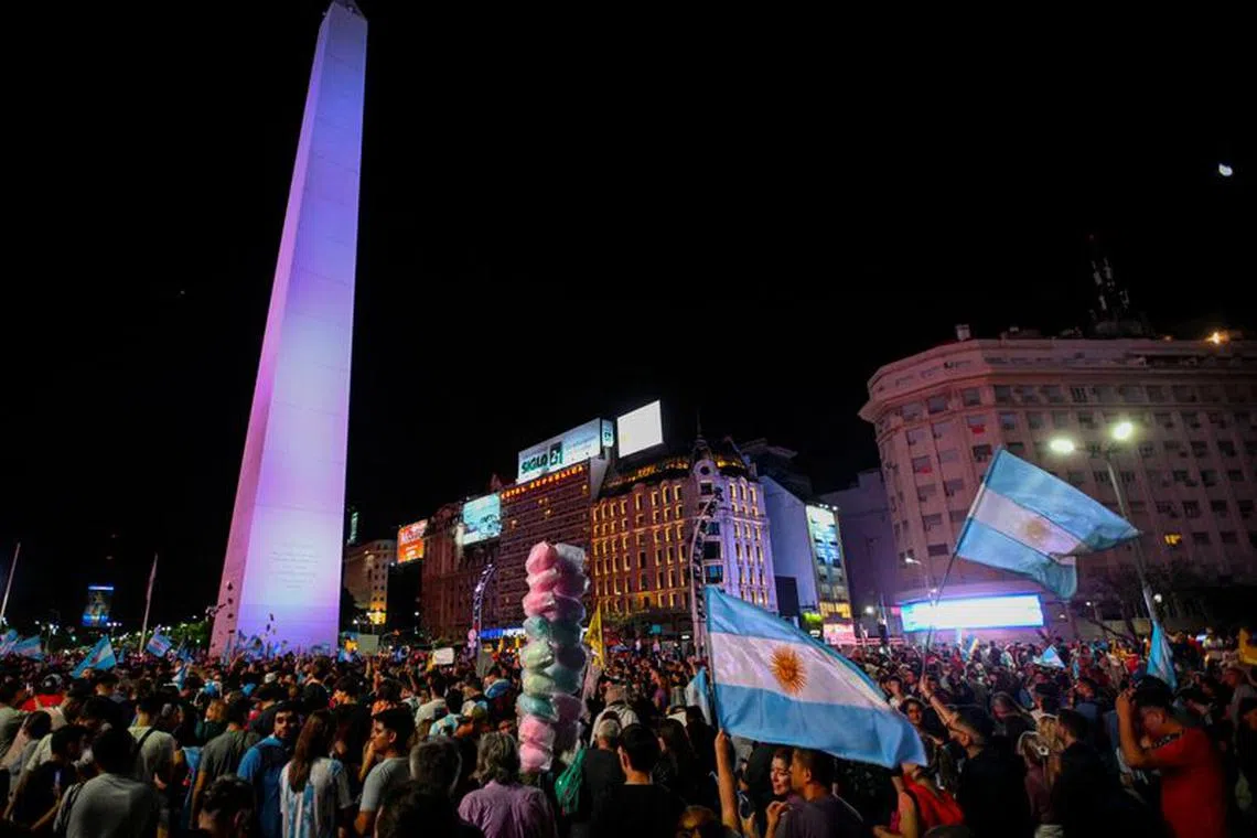 Argentine president-elect Javier Milei's supporters celebrate after Milei wins the runoff presidential election, in Buenos Aires, Argentina November 19, 2023. REUTERS/Mariana Nedelcu