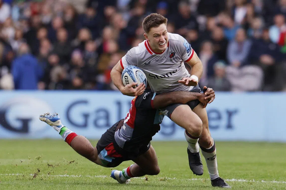 Rugby Union - Premiership - Harlequins vs Saracens - Twickenham Stoop, London, Britain - October 13, 2024 Saracens' Fergus Burke in action with Harlequins' Lennox Anyanwu Action Images/Andrew Couldridge