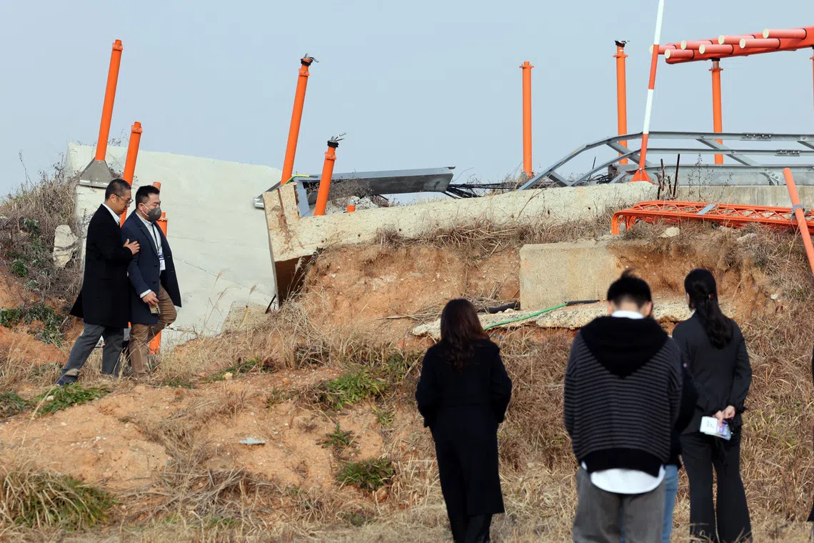 Bereaved family members at the site of the 2024 Jeju Air crash in Muan, South Korea, on Dec 29, the first anniversary of the disaster.