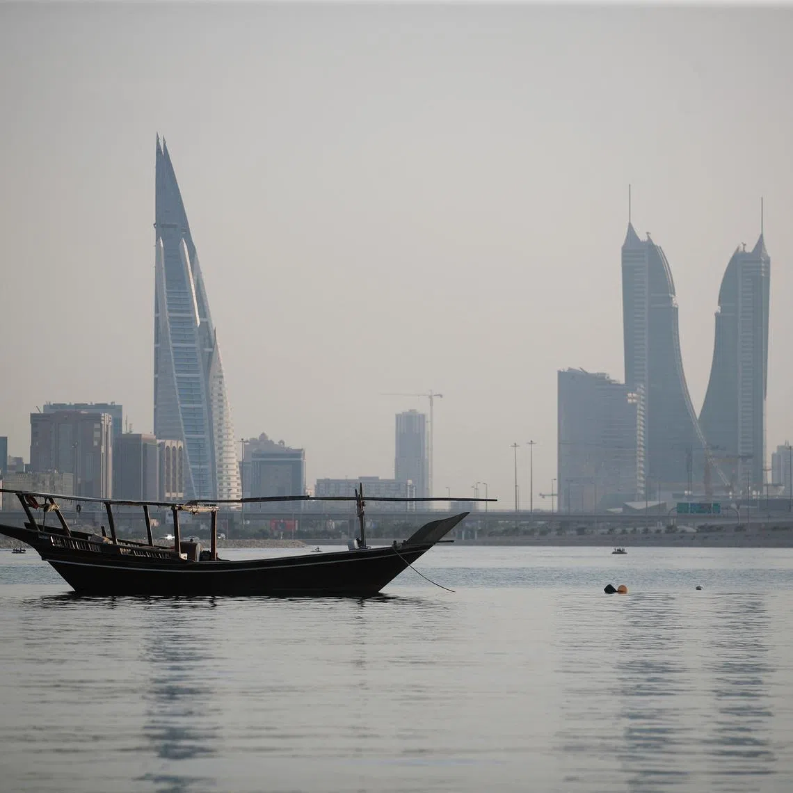 FILE PHOTO: A general downtown view is seen with heat haze over the skyline during the afternoon hours in Manama, Bahrain, August 2, 2023. REUTERS/Hamad I Mohammed/File Photo
