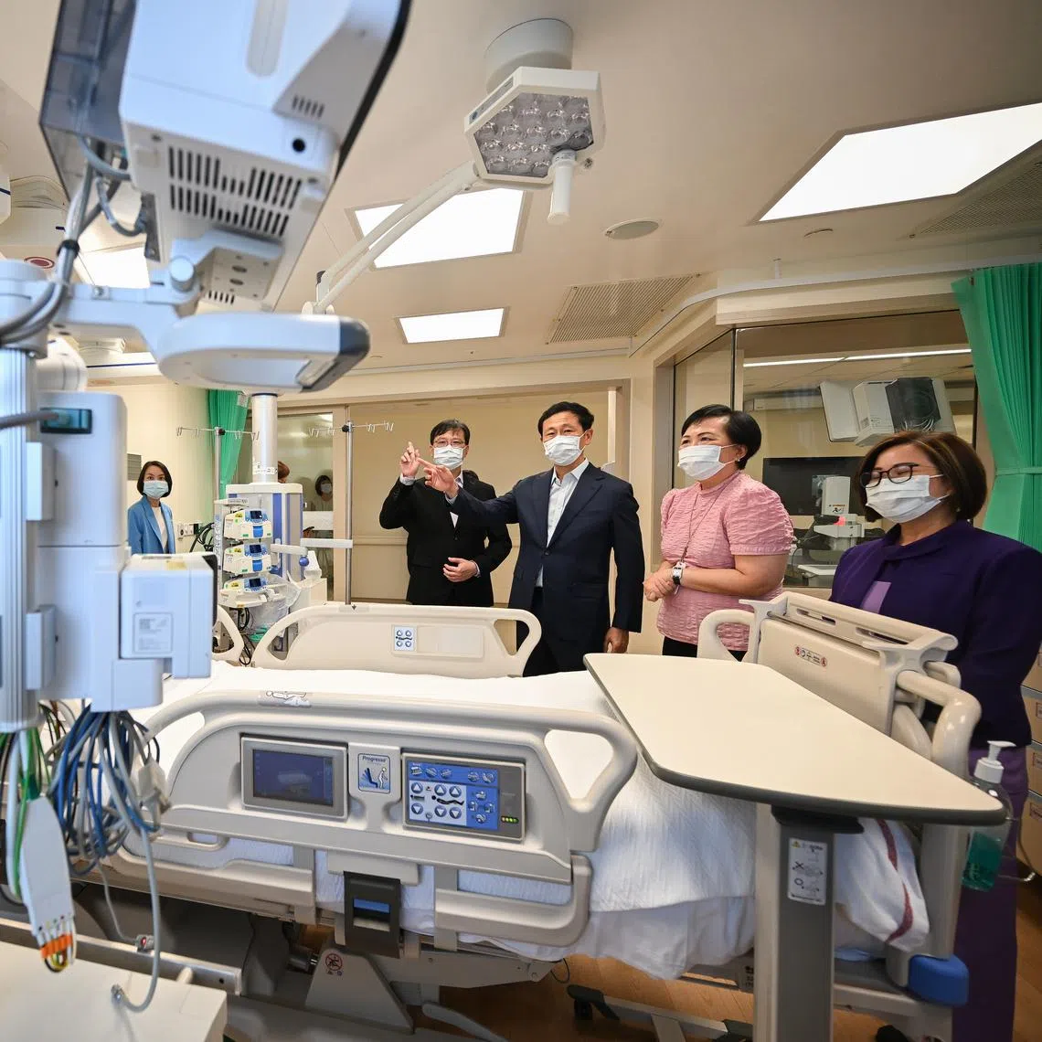 Health Minister Ong Ye Kung, flanked by chief executive James Lam and deputy director of nursing Kathleen Low, touring an upgraded ICU at Mount Alvernia Hospital on April 9.