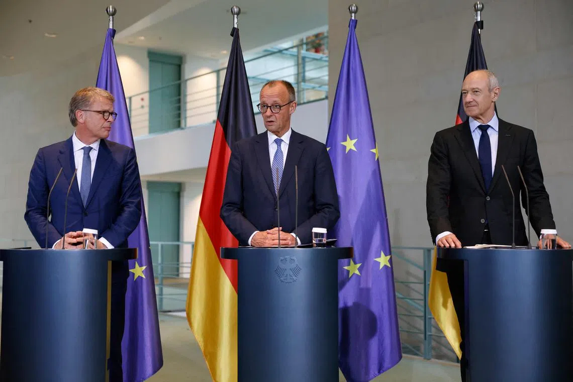 German Chancellor Friedrich Merz (centre) with Deutsche Bank CEO Christian Sewing (left) and Siemens CEO Roland Busch at the launch of the “Made for Germany” initiative in Berlin on July 21.