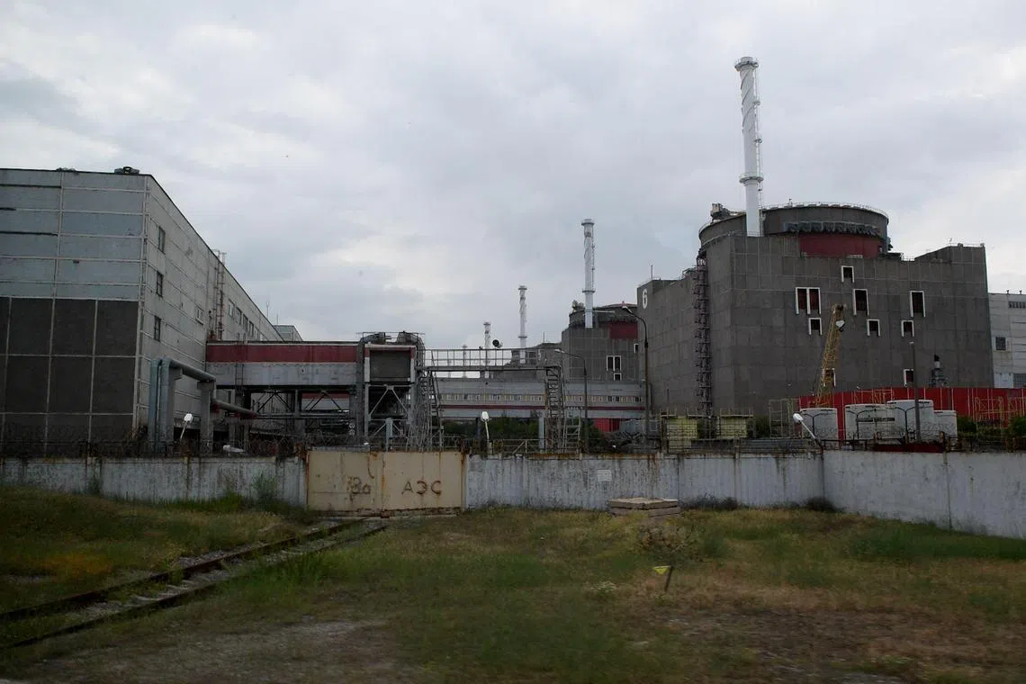 (FILES) A view of the Russian-controlled Zaporizhzhia nuclear power plant in southern Ukraine on June 15, 2023. The UN nuclear watchdog said on January 3, 2024 that it had recently been blocked for the first time from inspecting the reactor halls of three units of Ukraine's Russian-held Zaporizhzhia power plant, further limiting access to the site. The nuclear plant has been at the centre of fighting since it was captured by Russian forces in 2022, and both sides have accused each other of compromising its safety. (Photo by Olga MALTSEVA / AFP)