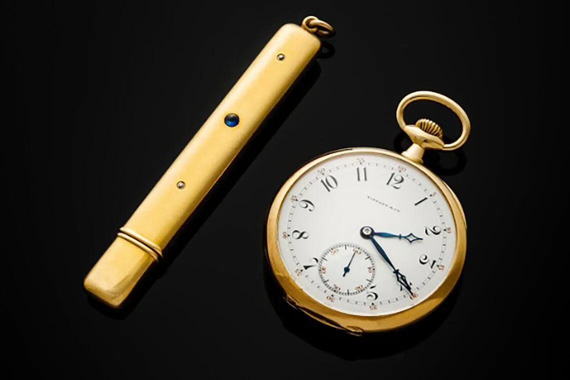 John Jacob Astor IV's Tiffany & Co.-signed Patek Philippe pocket watch (right) and a gold and sapphire Battin & Co. pencil case will be auctioned by Freeman's on April 22.