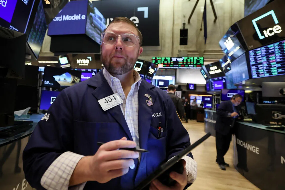 Traders work on the floor of the New York Stock Exchange, in New York City, on March 23, 2023.