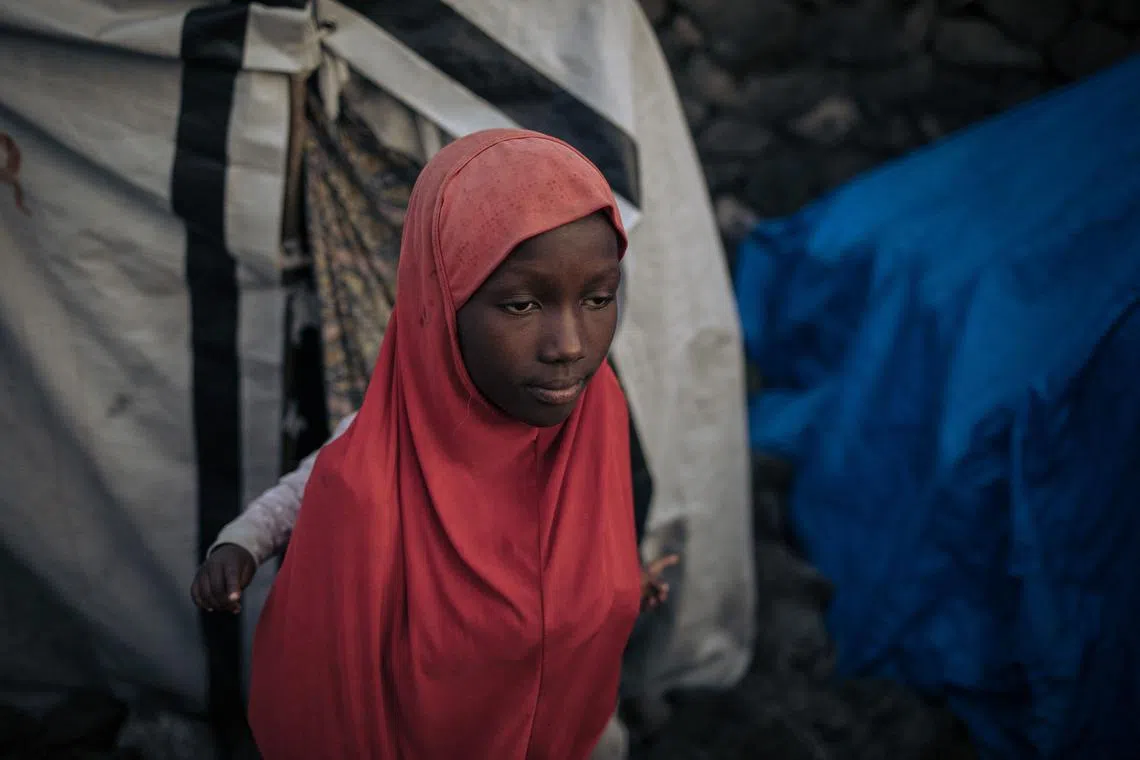 A displaced Muslim girl waiting in an informal displacement camp in Goma, eastern Democratic Republic of Congo, March 27.
