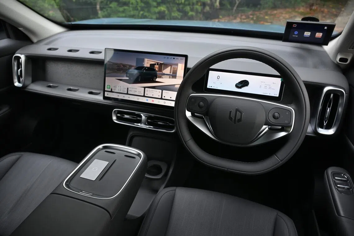 Those holes beside the touchscreen can be used to hook takeaway food.
