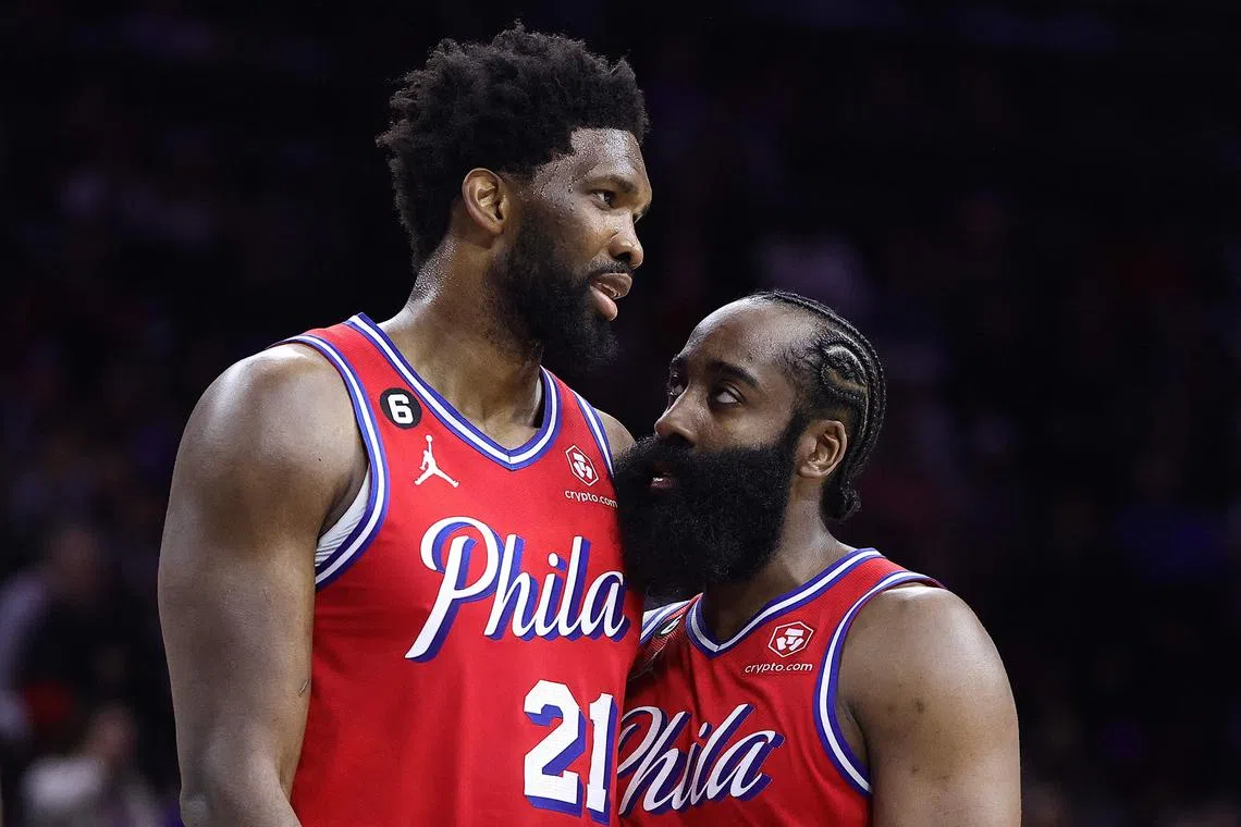 The Philadelphia 76ers' Joel Embiid (left) and James Harden speak during the fourth quarter against the LA Clippers at Wells Fargo Centre.