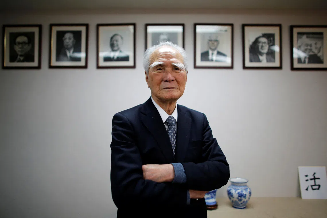 Former Japanese Prime Minister Tomiichi Murayama poses in front of portraits of former leaders of his Social Democratic Party after an interview with Reuters at the party headquarters in Tokyo March 10, 2015. REUTERS/Toru Hanai