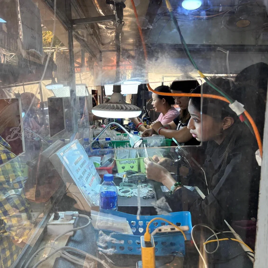 pwmyanmar - The bustling jade market in Mandalay is widely considered as the world's largest. Mandalay is a trading hub along Myanmar's main economic corridor with China. (Pic taken Jan 12) CREDIT: PHILIP WEN
