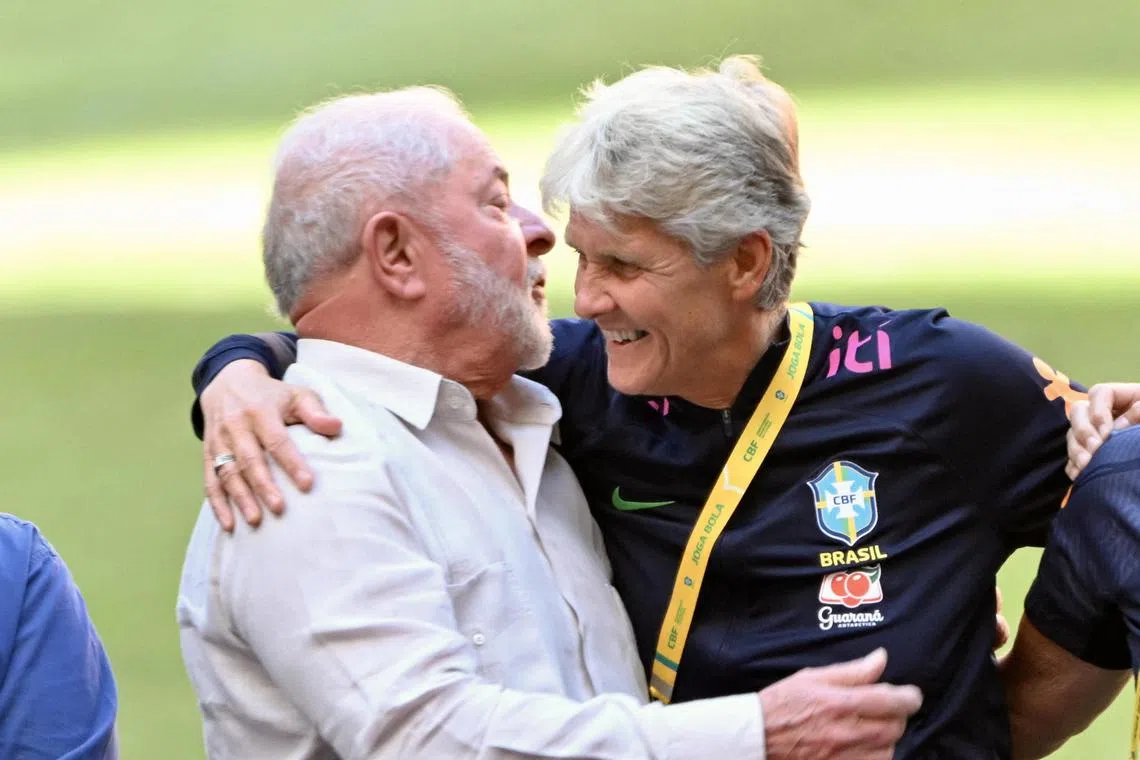 Brazilian President Luiz Inacio Lula da Silva (left) hugging Brazil's Swedish coach Pia Sundhage during a meeting with the women's national football team in Brasilia on July 1.