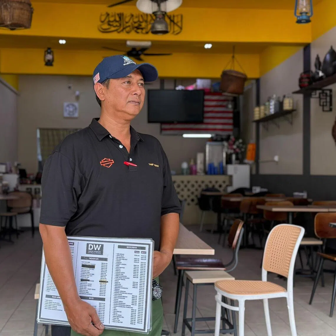 Chef Teddy at his empty cafe in Puncak Jalil, Selangor, where business is down 30 per cent as severe haze keeps diners away.