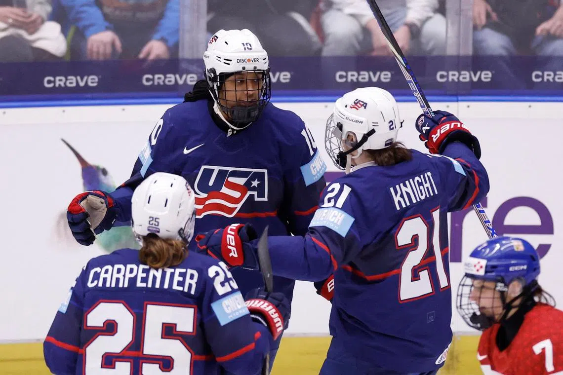 Ice Hockey - IIHF Women's World Championships - Semi Final - United States v Czech Republic - Budvar Arena, Ceske Budejovice, Czech Republic - April 19, 2025 Laila Edwards of the U.S. celebrates scoring their first goal with Hilary Knight and Alex Carpenter REUTERS/David W Cerny