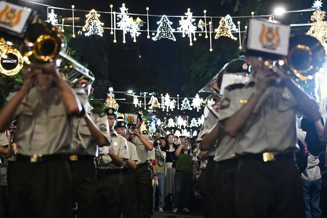 ST20241224_202430800741-Lim Yaohui-pixchristmas24/ NCC Command Band by Swiss Cottage Secondary School performing the opening act for the Great Christmas Eve Street Party at Orchard Road on Dec 24, 2024. The much-anticipated Great Christmas Eve Street Party is making a triumphant return, stretching 400m from ION Orchard to Ngee Ann City. It will feature live DJ performances, roving mascots, pop-up stalls, food trucks, as well as a countdown to Christmas, among other offerings. A section of Orchard Road from Paterson Road junction to Bideford Road junction will be closed to vehicular traffic on 24 December 2024 from 6pm to 2am for revellers as the countdown to Christmas Day begins at 8pm. (ST PHOTO: LIM YAOHUI)