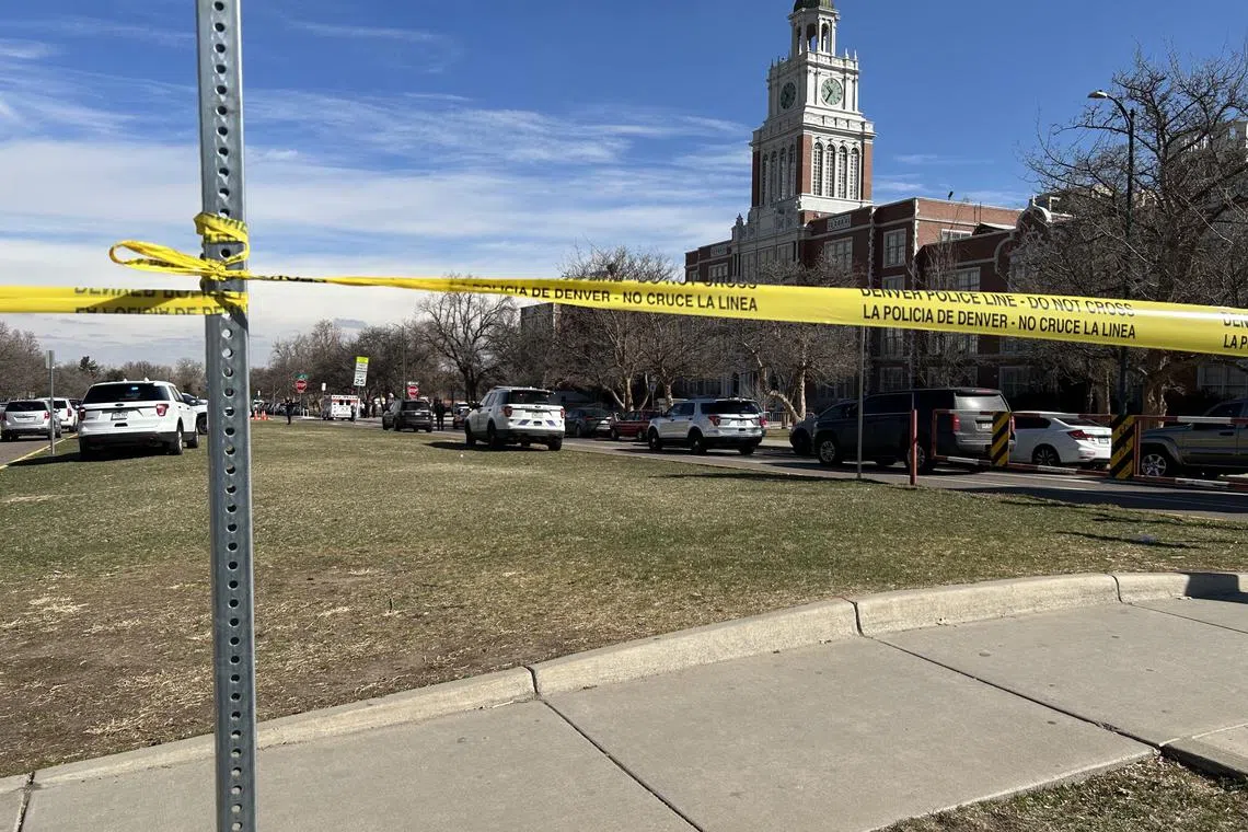 A student at East High School in Denver was being patted down as part of a search for weapons when he produced a handgun and began shooting.