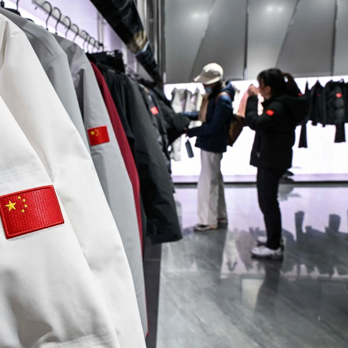 Customers browse in an Anta store on Jan 27.