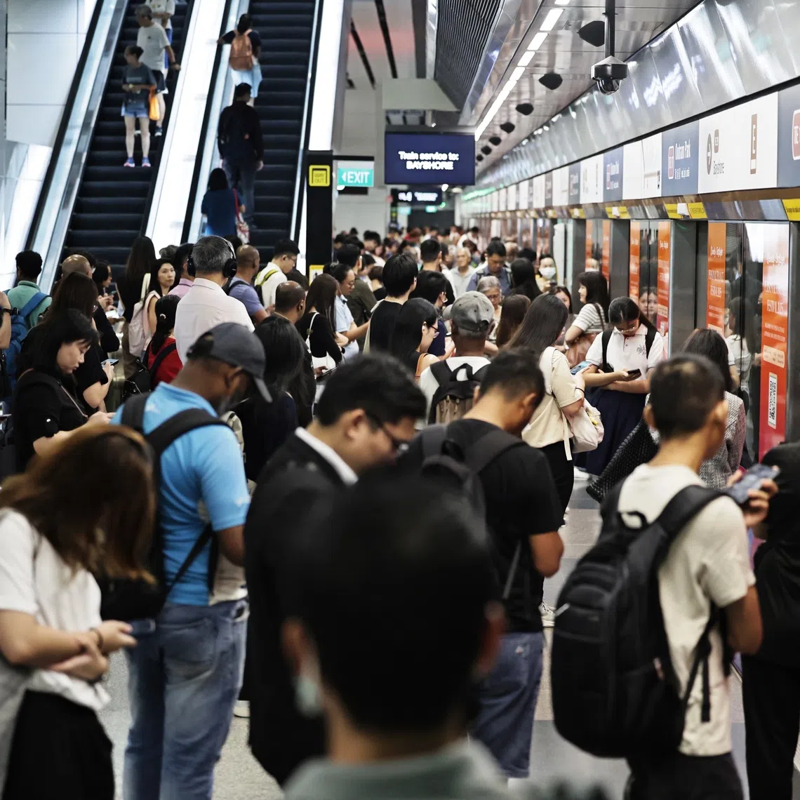 Members of the public waiting during a delay on the Thomson-East Coast line at Outram Park MRT station on Sept 17.