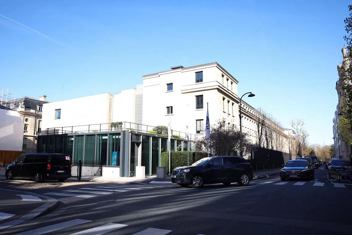 A Chinese delegation arrives at the Organisation for Economic Co-operation and Development (OECD) headquarters for trade talks with a U.S. delegation, in Paris, France, March 15, 2026. REUTERS/Abdul Saboor