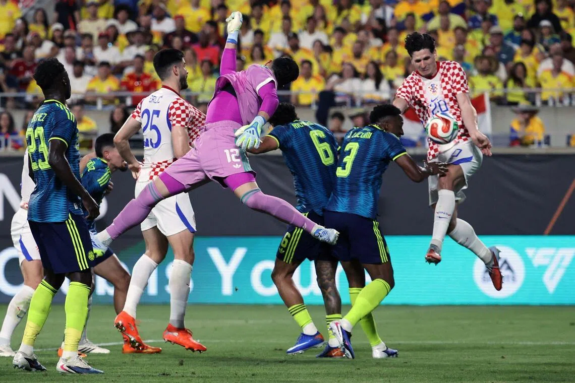 Igor Matanovic heading in Croatia's second goal in the international friendly match against Colombia at Camping World Stadium on March 26, 2026 in Orlando, Florida. Croatia won 2-1.