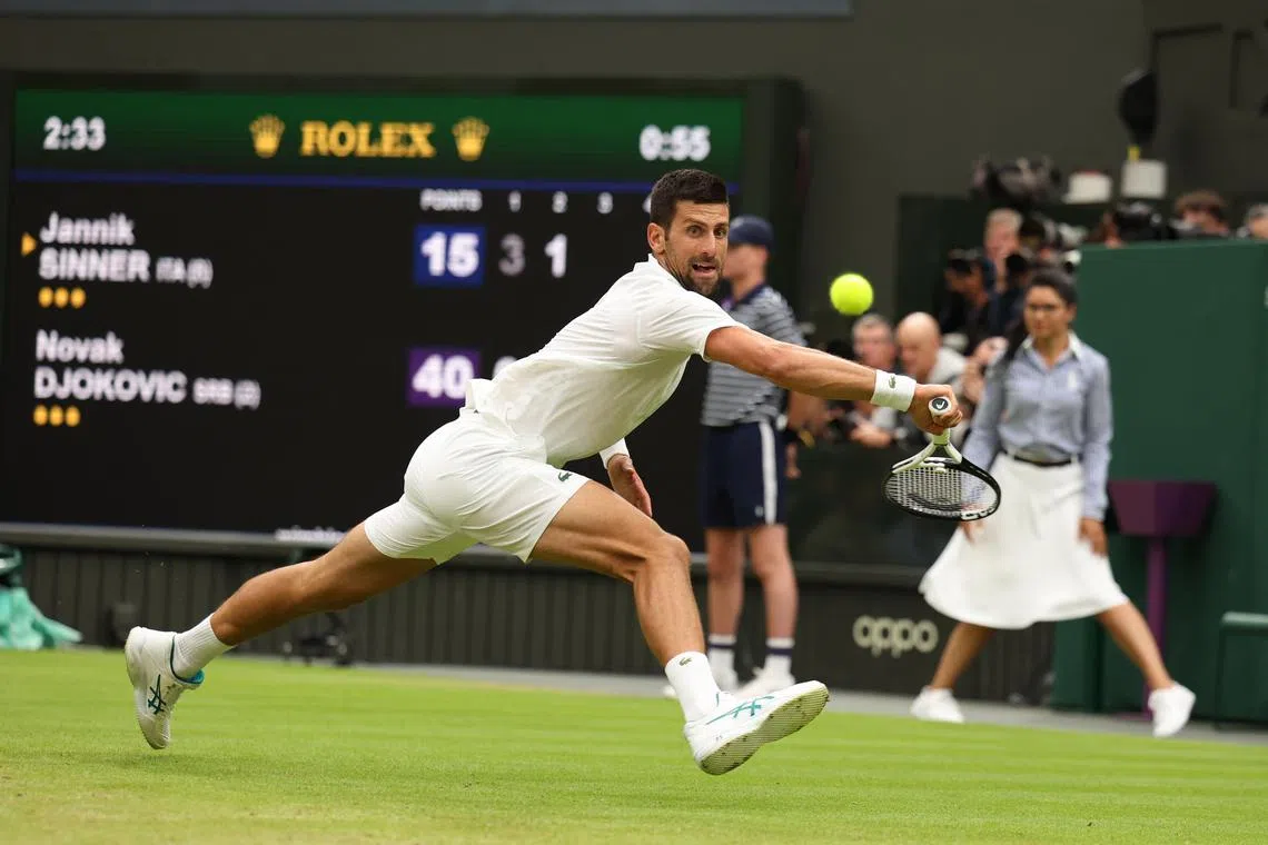 epa10746399 Novak Djokovic of Serbia in action during his Men's Singles semi-final match against Jannik Sinnner of Italy at the Wimbledon Championships, Wimbledon, Britain, 14 July 2023.  EPA-EFE/NEIL HALL   EDITORIAL USE ONLY