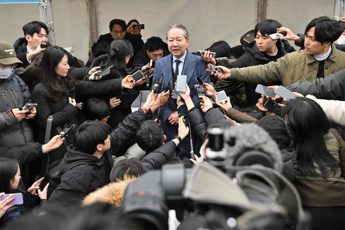 The KMA’s Dr Joo Soo-ho (centre) has been accused of “aiding and abetting” the protests and appeared at the Seoul Metropolitan Police Agency for questioning March 6.