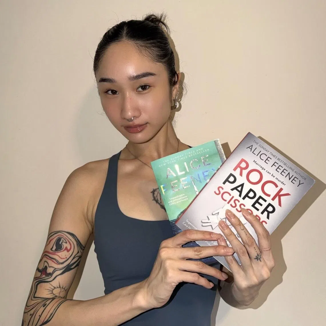Kaci Beh with Rock Paper Scissors by Alice Feeney, a thriller she says keeps her "hooked and guessing". 