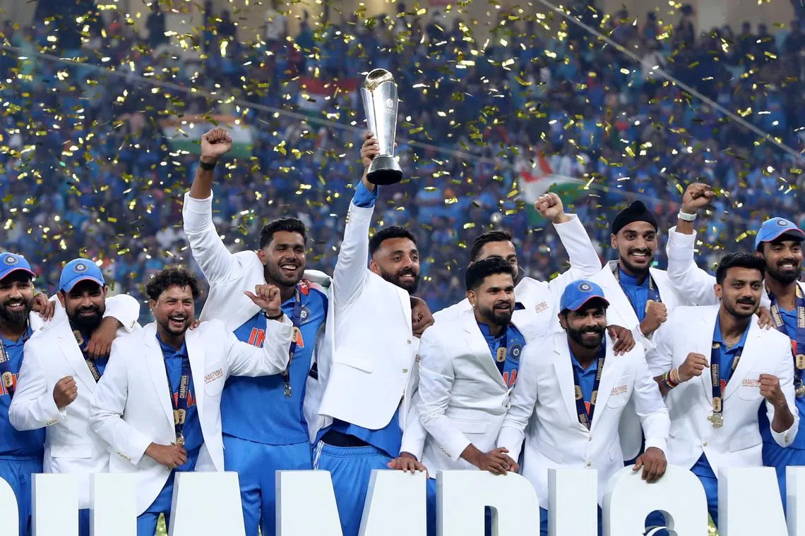Cricket - ICC Men's Champions Trophy - Final - India v New Zealand - Dubai International Stadium, Dubai, United Arab Emirates - March 9, 2025 General view as India players celebrate with the trophy on the podium after winning the ICC Men's Champions Trophy REUTERS/Satish Kumar
