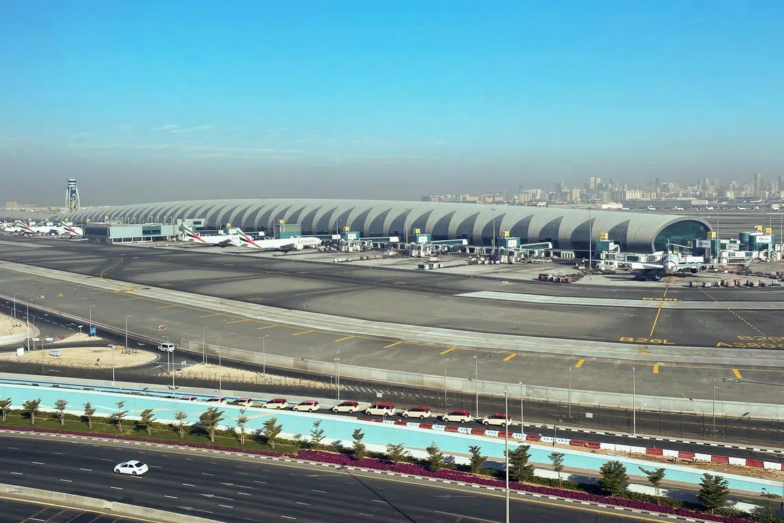 FILE PHOTO: Airliners are seen on the tarmac in a general view of Dubai International Airport in Dubai, United Arab Emirates January 13, 2021. Picture taken through a window. REUTERS/Abdel Hadi Ramahi/File Photo