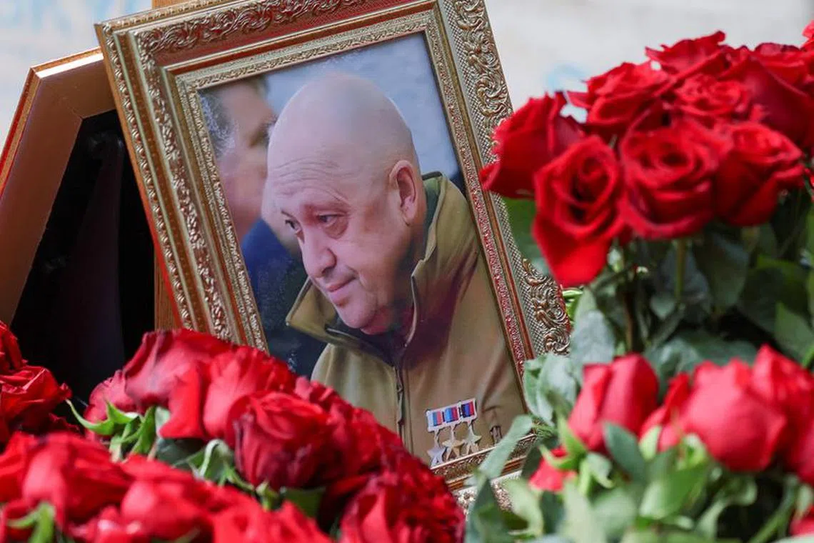 A view shows a framed photo of Russian mercenary chief Yevgeny Prigozhin at his grave at the Porokhovskoye cemetery in Saint Petersburg, Russia, August 30, 2023. REUTERS/Stringer/File Photo