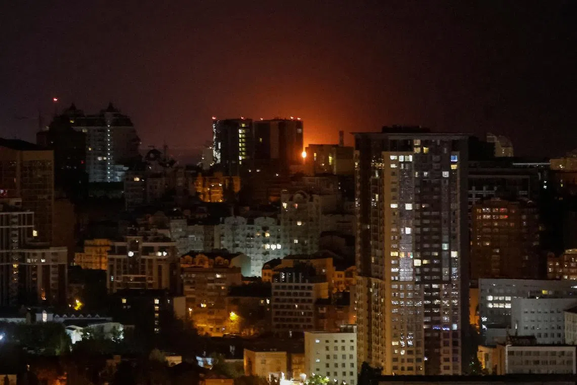 An explosion of a drone is seen in the sky over the city, during a Russian drone strike, amid Russia's attack on Ukraine, in Kyiv, Ukraine April 29, 2025. REUTERS/Gleb Garanich