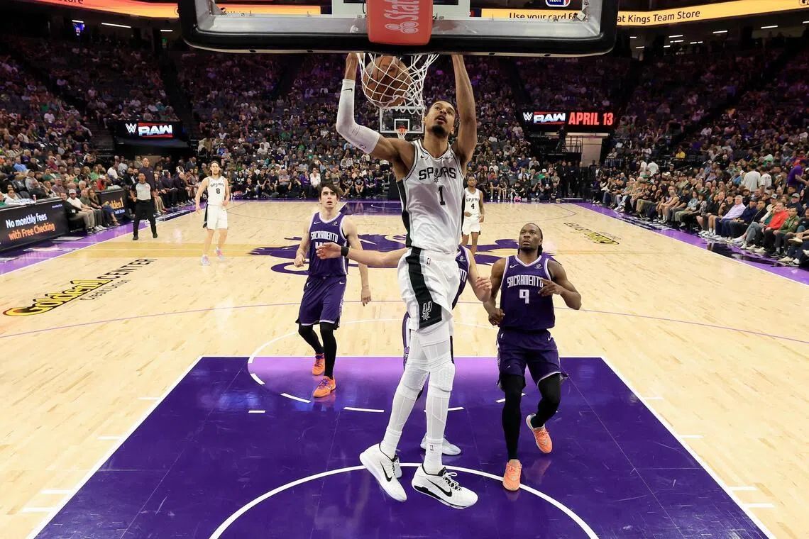 Victor Wembanyama of the San Antonio Spurs dunks the ball against the Sacramento Kings in the first half at Golden 1 Center.