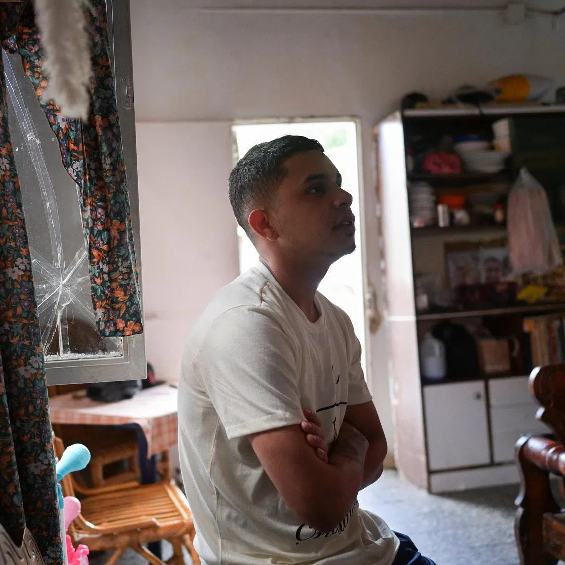 Neiyerver Adrian Leon Rengel, who has filed a formal complaint against the U.S. government for sending him to El Salvador's most notorious prison, claiming he was falsely accused of gang membership by U.S. President Donald Trump's administration, looks on during an interview, in Caracas, Venezuela July 29, 2025. REUTERS/Gaby Oraa