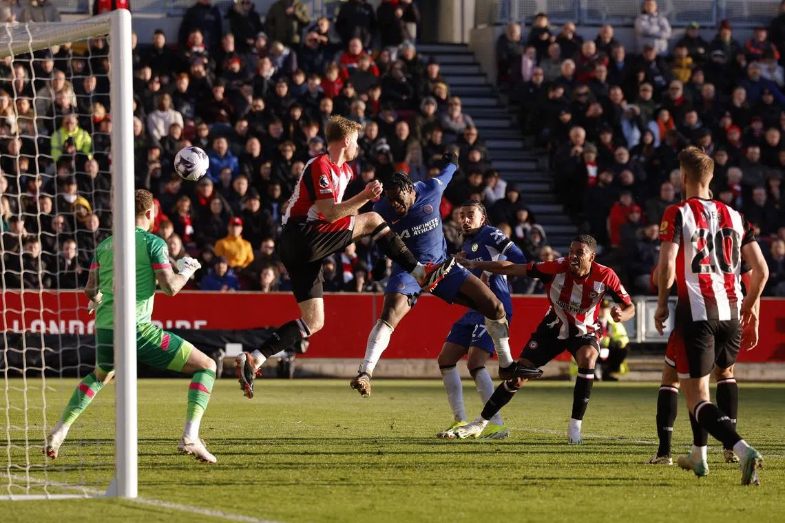 Soccer Football - Premier League - Brentford v Chelsea - Brentford Community Stadium, London, Britain - March 2, 2024
Chelsea's Axel Disasi scores their second goal past Brentford's Mark Flekken Action Images via Reuters/Andrew Couldridge NO USE WITH UNAUTHORIZED AUDIO, VIDEO, DATA, FIXTURE LISTS, CLUB/LEAGUE LOGOS OR 'LIVE' SERVICES. ONLINE IN-MATCH USE LIMITED TO 45 IMAGES, NO VIDEO EMULATION. NO USE IN BETTING, GAMES OR SINGLE CLUB/LEAGUE/PLAYER PUBLICATIONS.