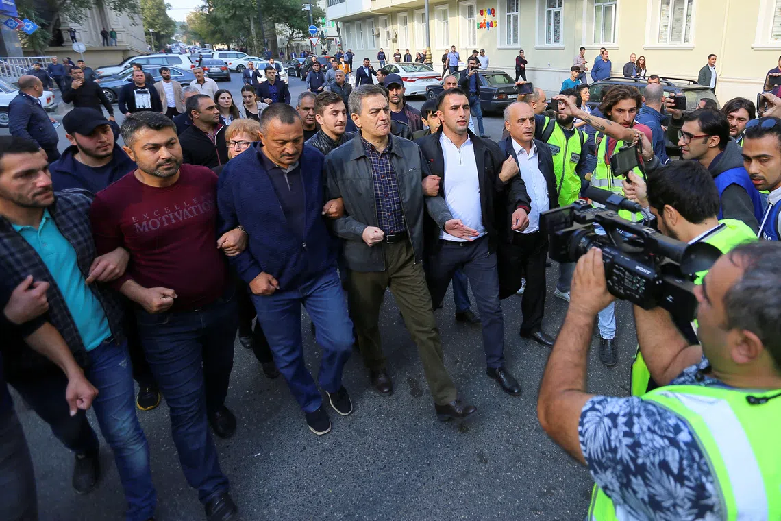 FILE PHOTO: Head of the Popular Front Party of Azerbaijan Ali Karimli and his supporters hold an unauthorized rally to demand the freedom of assembly in Baku, Azerbaijan October 19, 2019. REUTERS/Aziz Karimov/File Photo