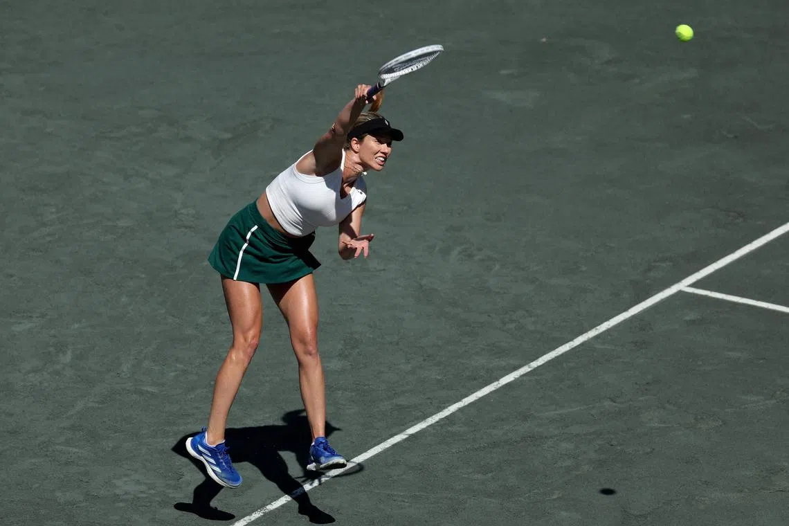 Danielle Collins of the United States serving to Daria Kasatkina during her 6-2, 6-1 Charleston Open final triumph on April 7.