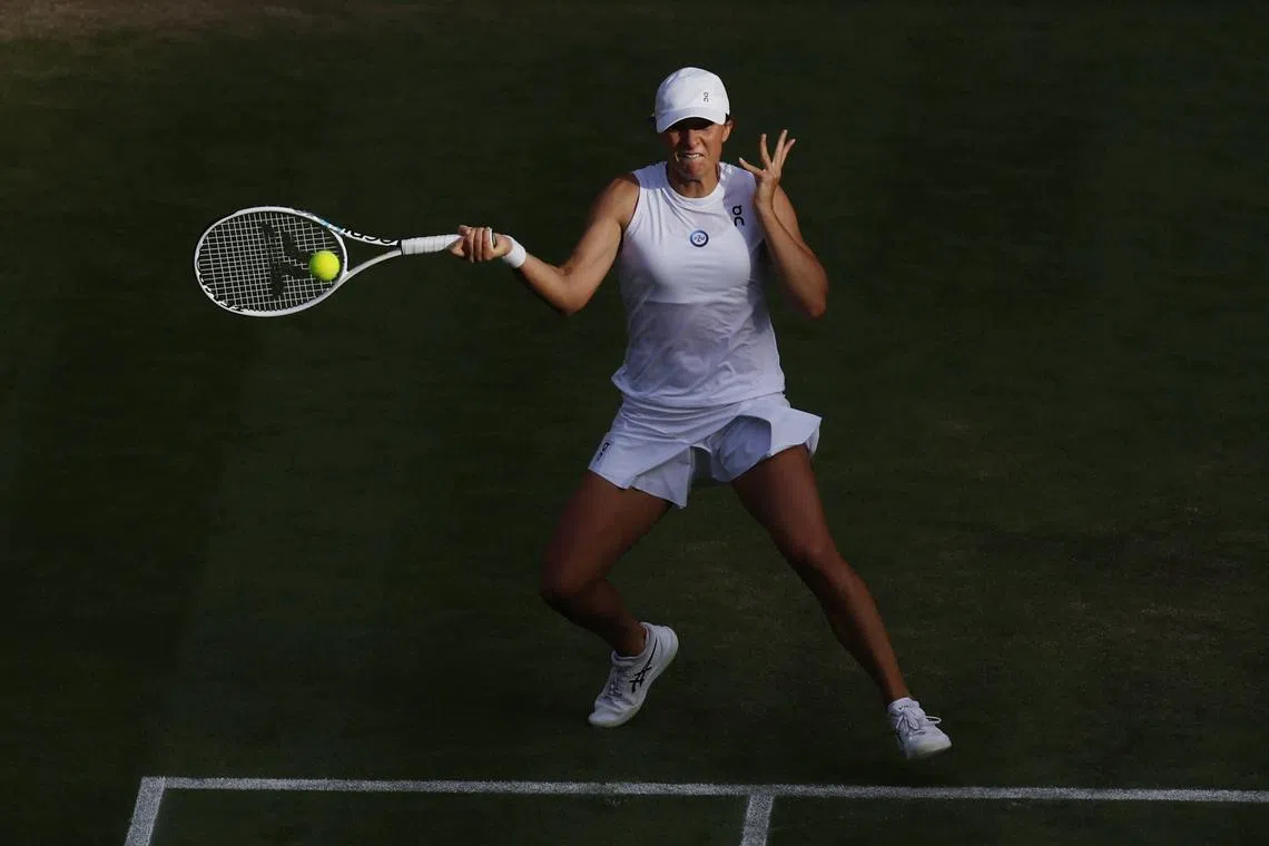 Poland's Iga Swiatek in action during her fourth round match against Switzerland's Belinda Bencic.