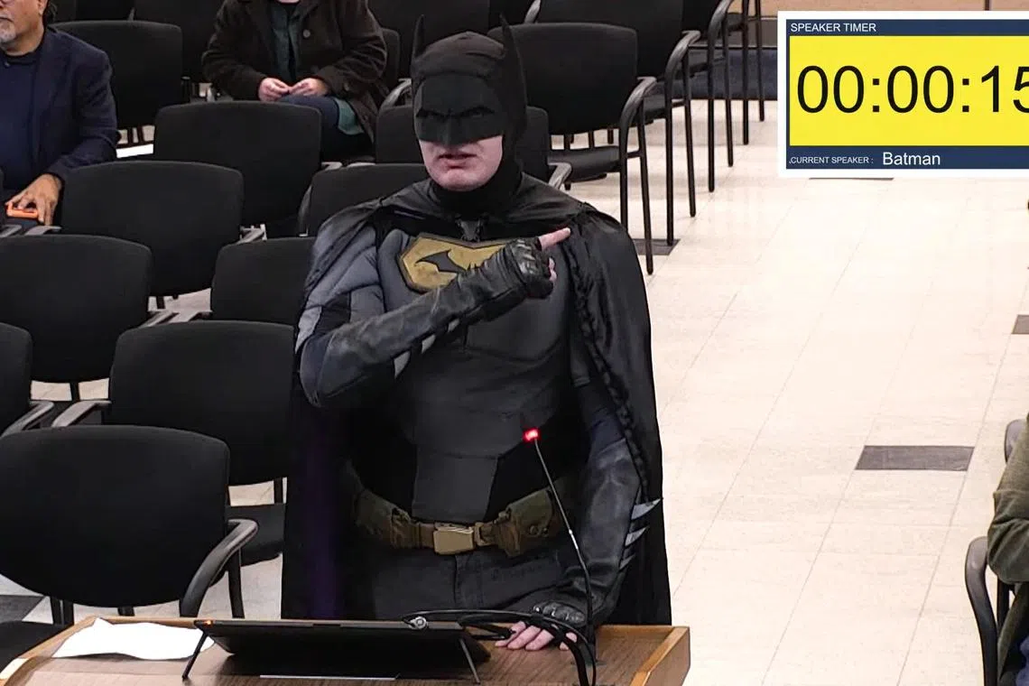 This screengrab from Jan 27 video shows a man dressed as Batman berating officials in the city set to host the Super Bowl in February.